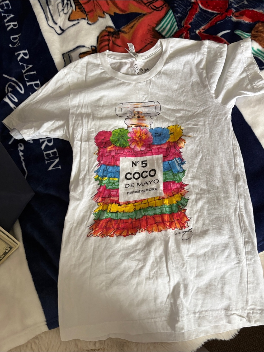 White Graphic Tee with Colorful Coco de Mayo Perfume Bottle